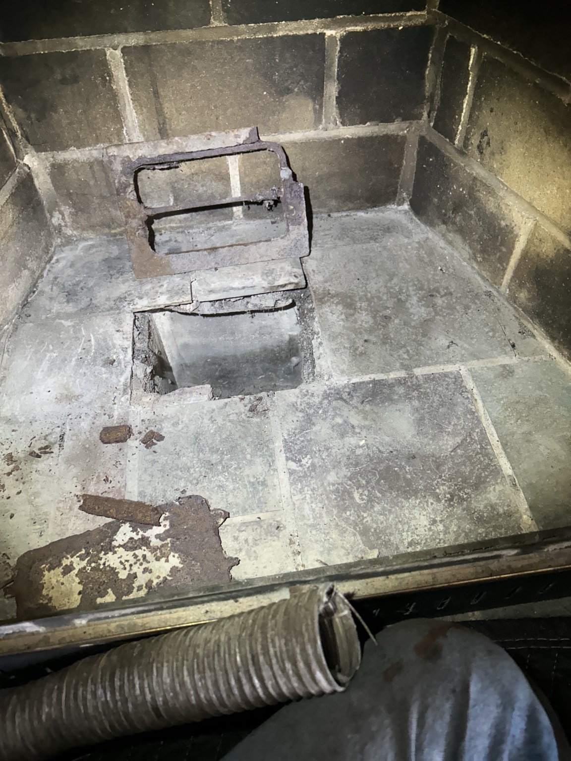 Damaged flue opening with missing masonry identified during chimney assessment in Caledon